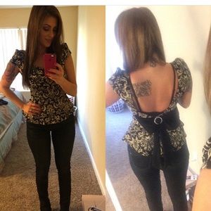 Cute top with bow on the back.