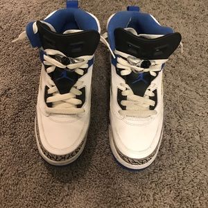 white , blue, and black Jordans (size 7y)