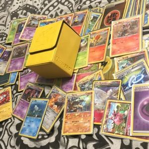 Korean Pokémon cards with cases on them
