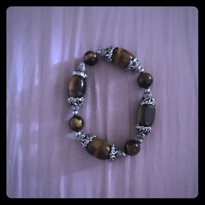 Gold, brown, and silver fashionable bracelet