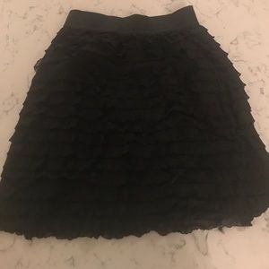 Black ruffle mini skirt