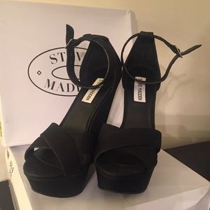 Steve Madden black strapped wedge heel.