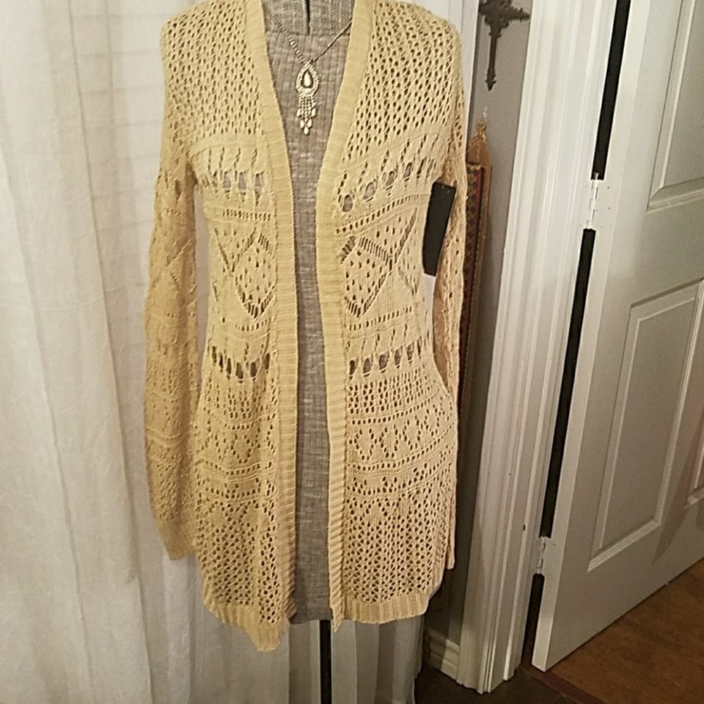 Beige crocheted cardigan sweater. New