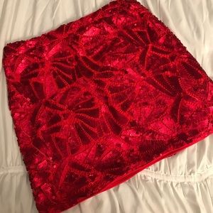 Red sequins short skirt.