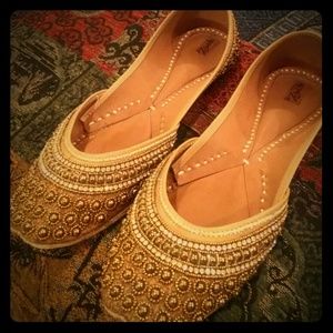 Shiny golden beaded genie flats from Zebidah