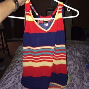 A vibrant colored beautifully strapped blouse