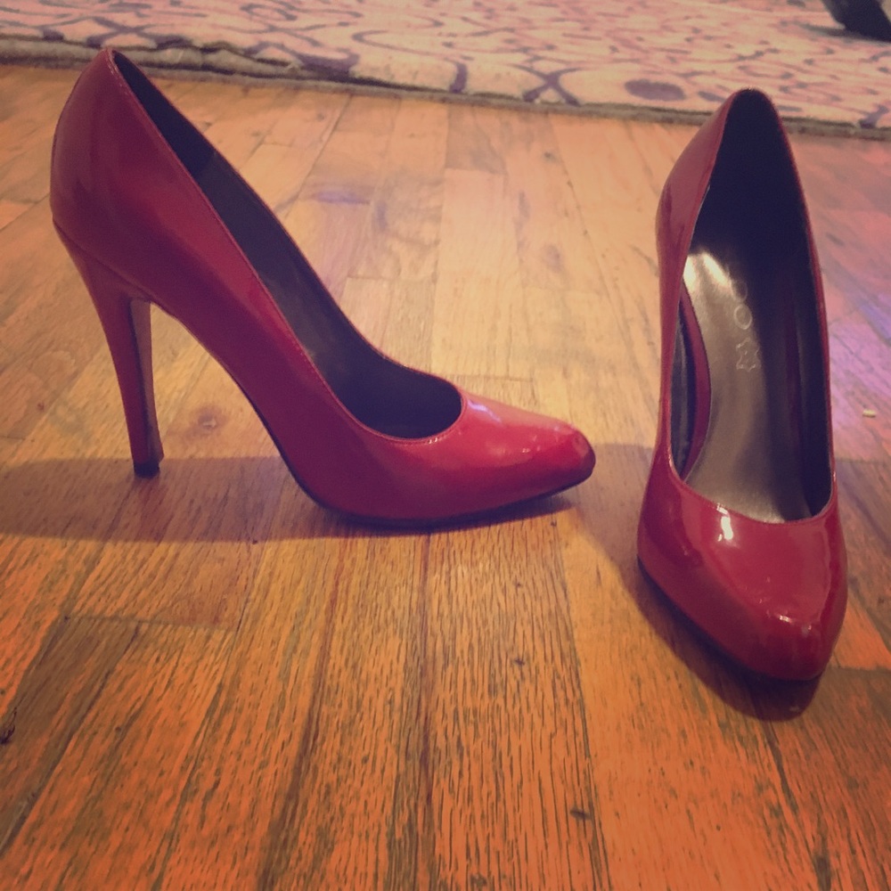 ALDO red patent pumps