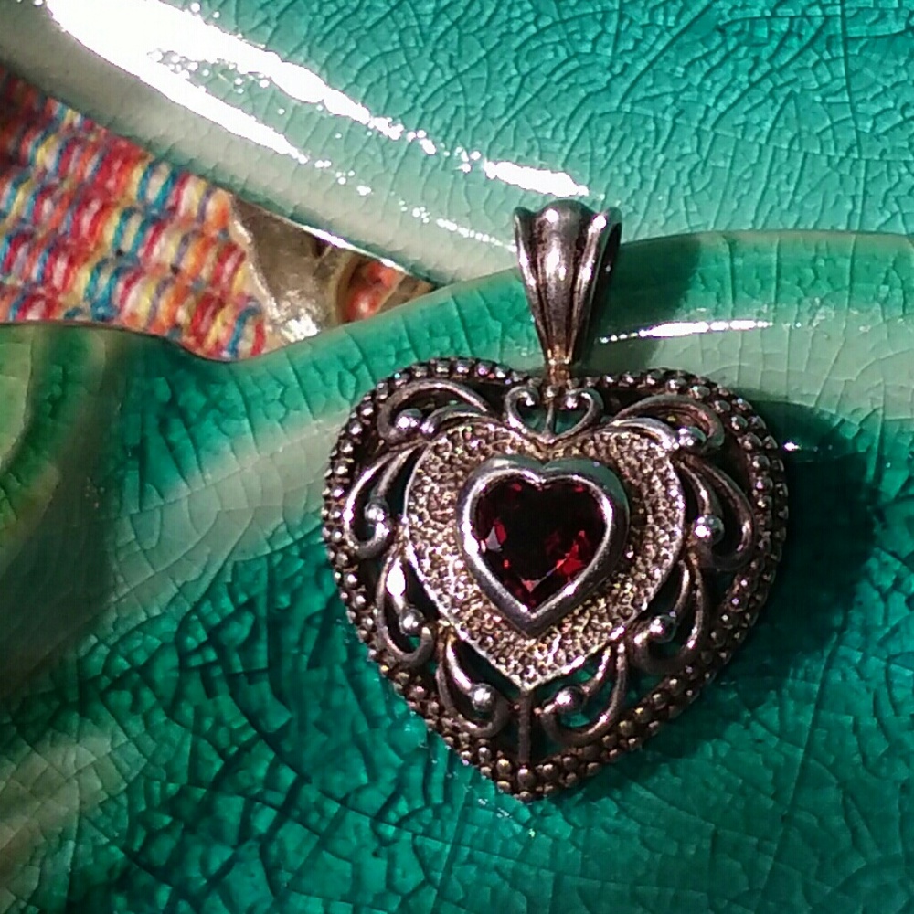 Sterling silver heart charm with red stone
