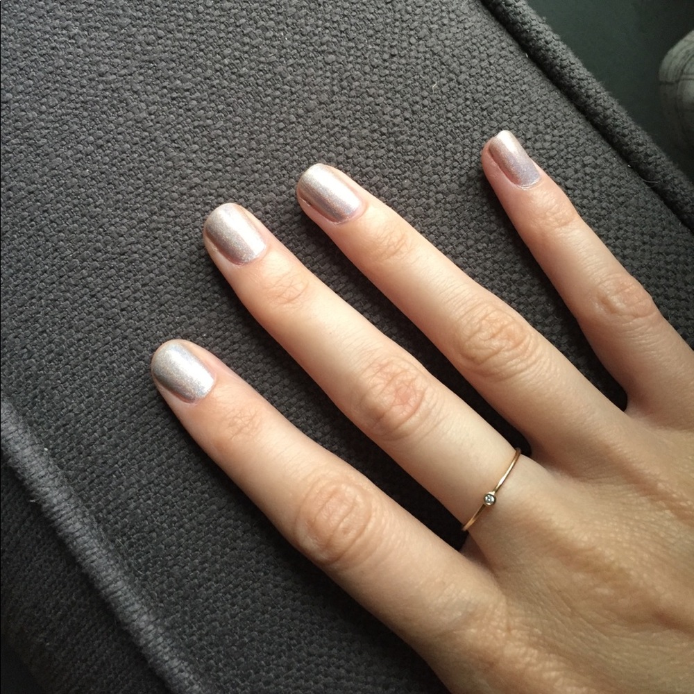 Thin gold ring with small round diamond