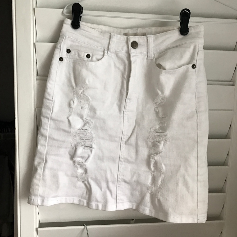 White, distressed denim skirt