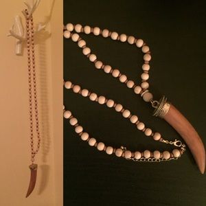 Beaded necklace with fake horn