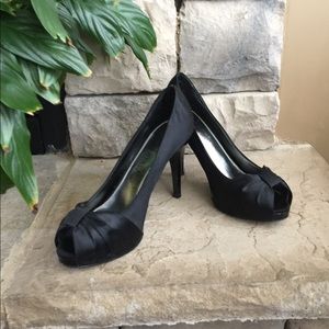 Dressy satin peep toe pump.