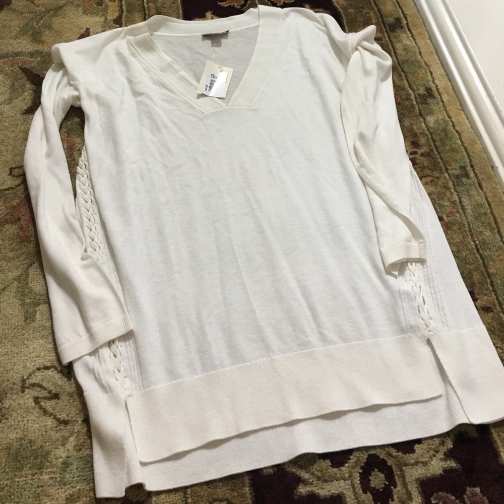 Cream sweater with cute detailing!