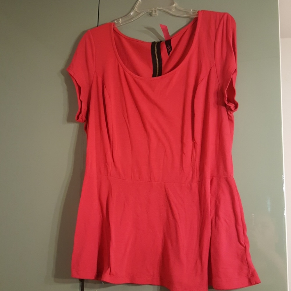 Pink peplum top.