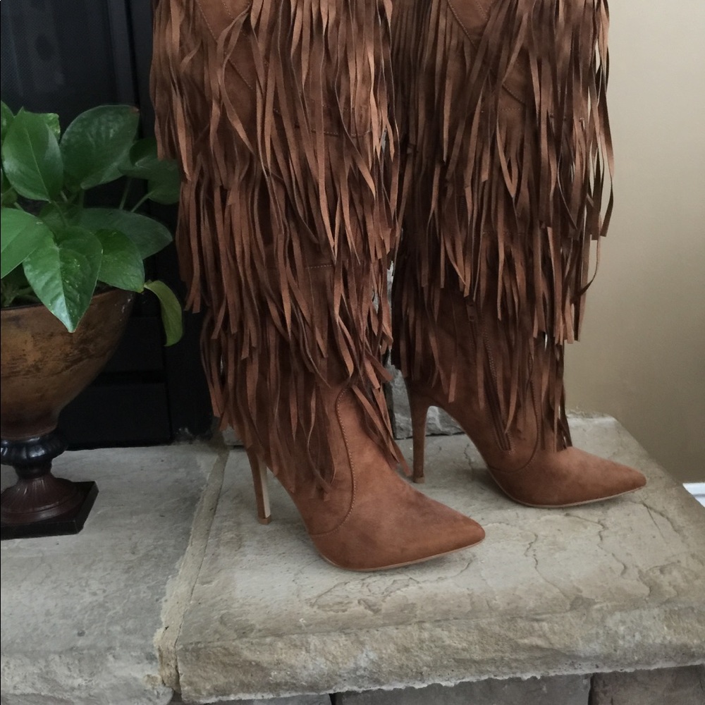 Below the knee tassel heeled boots.