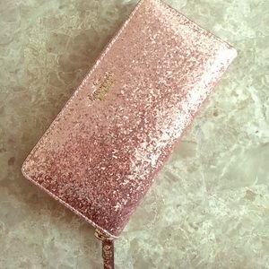 Kate Spade rose gold glitter bug wallet.