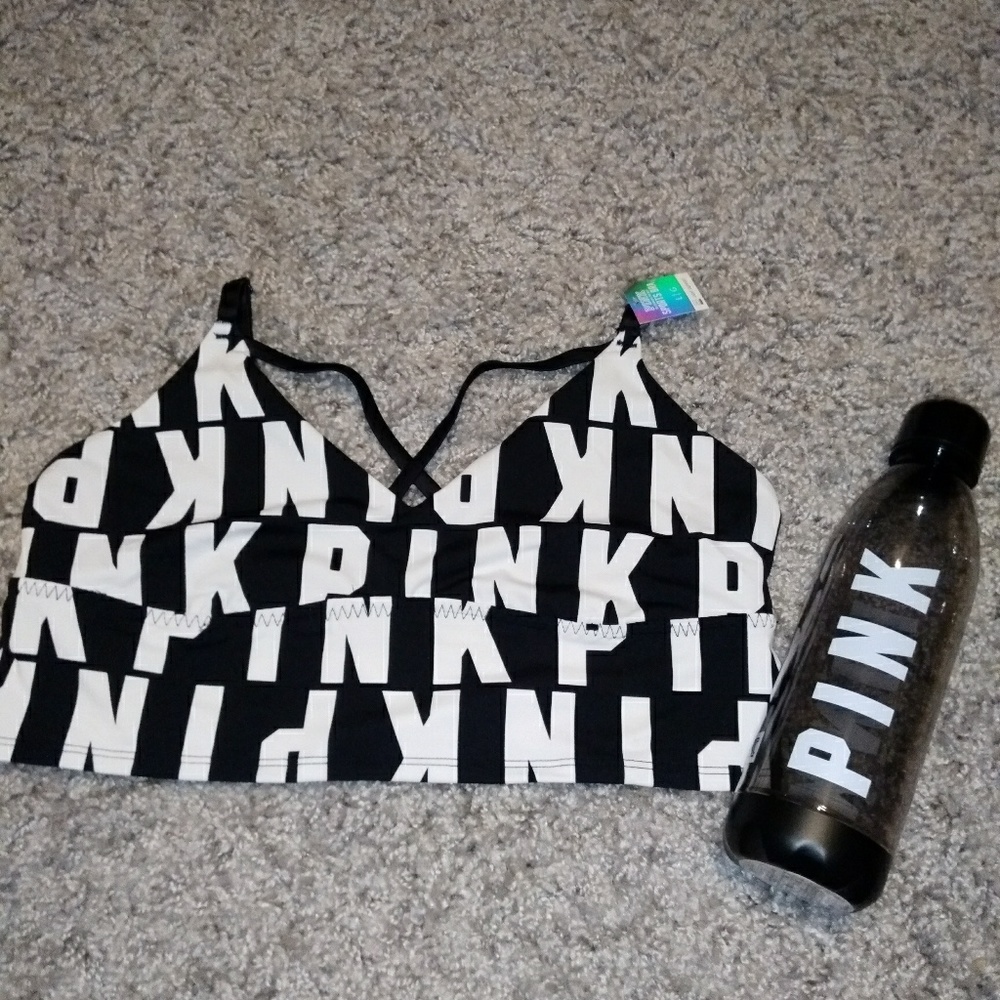 Pink sports bra and water bottle