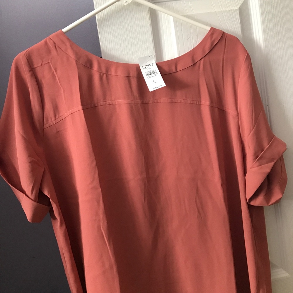 A orangish colored blouse