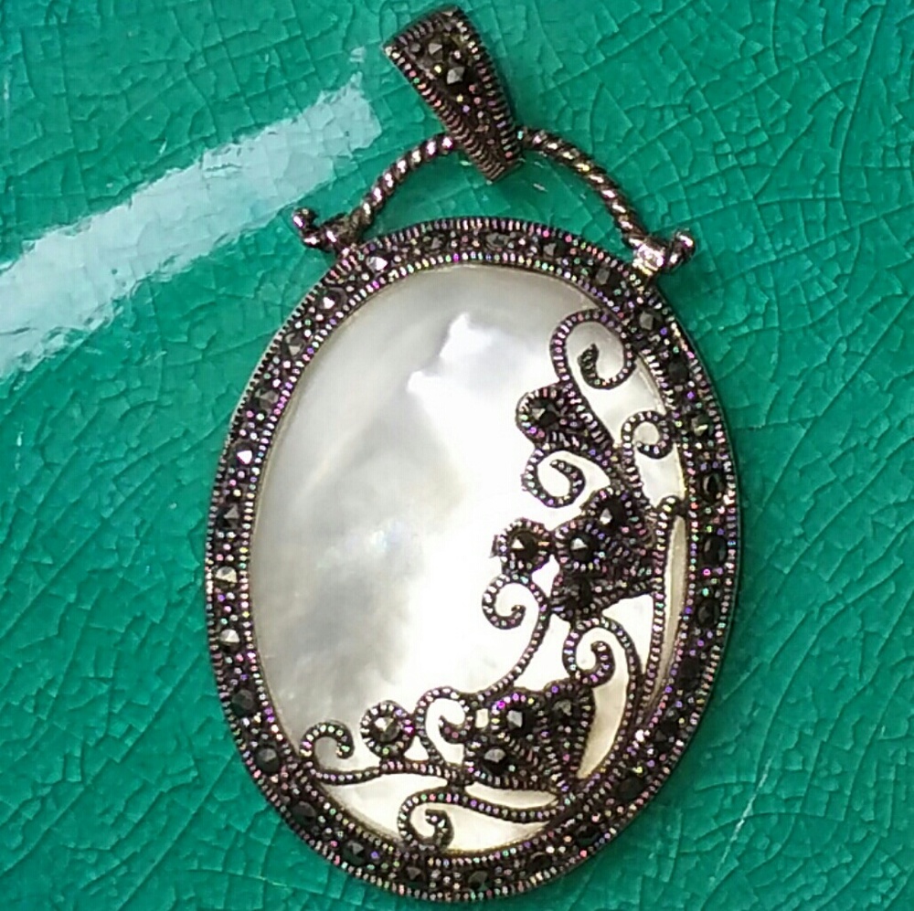 Sterling silver mother of pearl charm