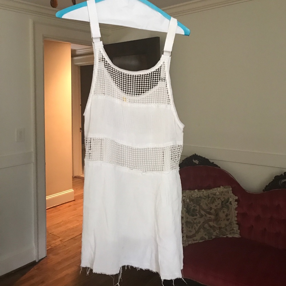White tank top with cutouts and frayed bottom