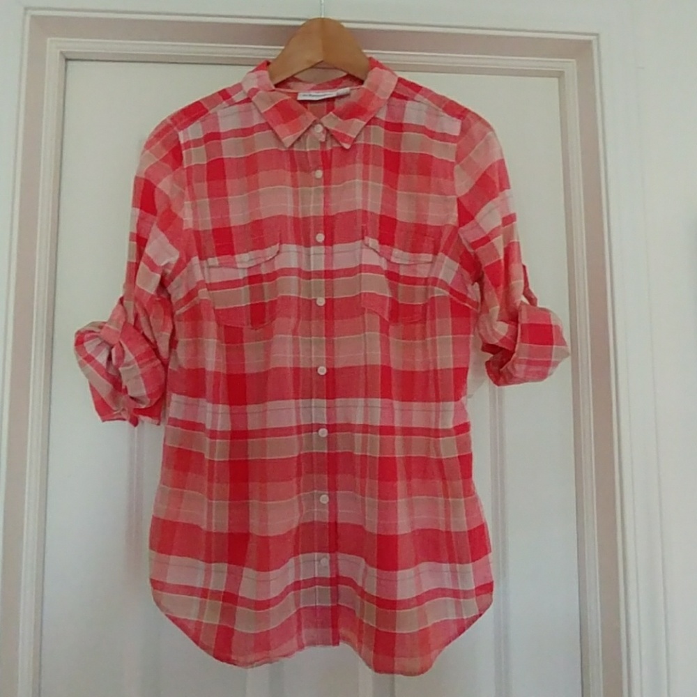 Peach colored button up shirt