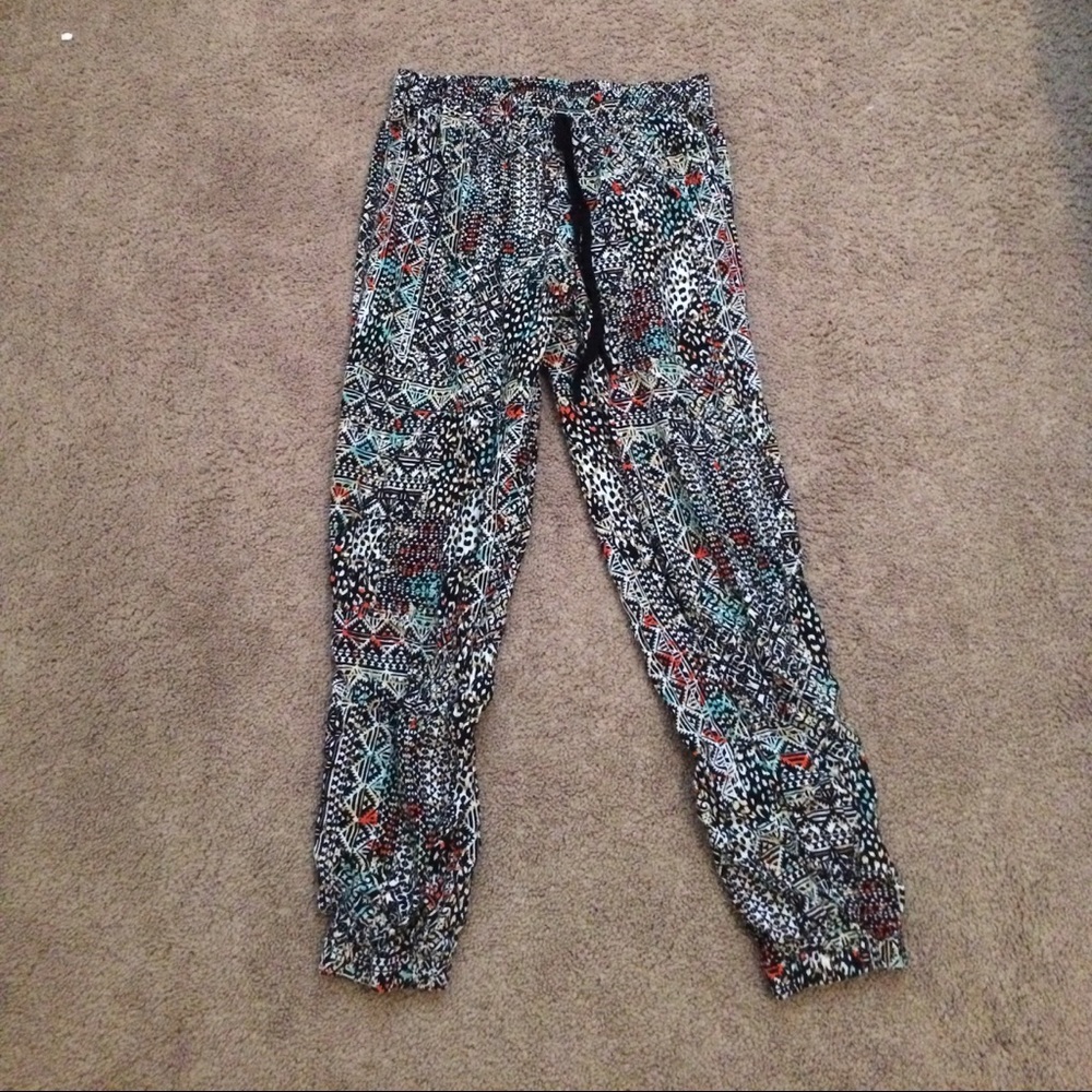 A pair of wet seal loose pants