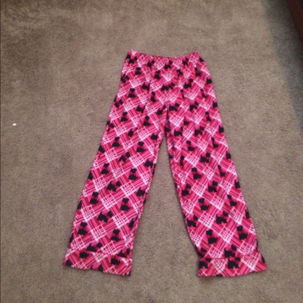 Pink pajama pants with dogs on them