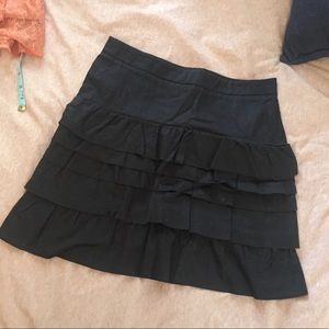 Black ruffled skirt.