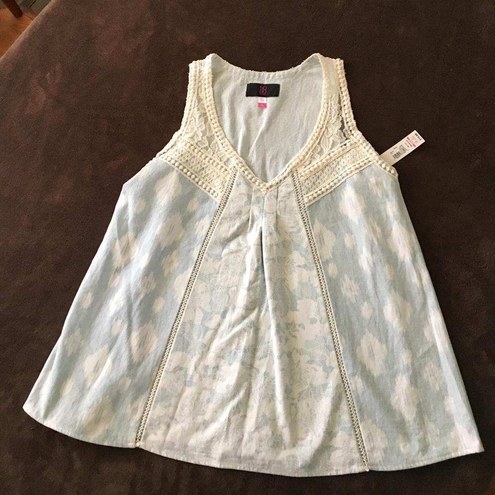 Jean top/white accents. Brand No Bo.  Fits lrg.