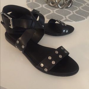 Black silver studded ankle wraps flat sandals.