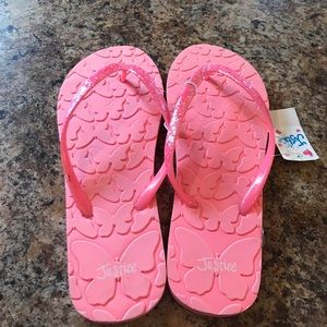 Pink flip flops from Justice.