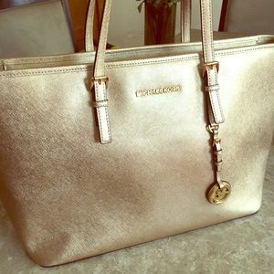 Michael Kors shimmery gold tote bag.