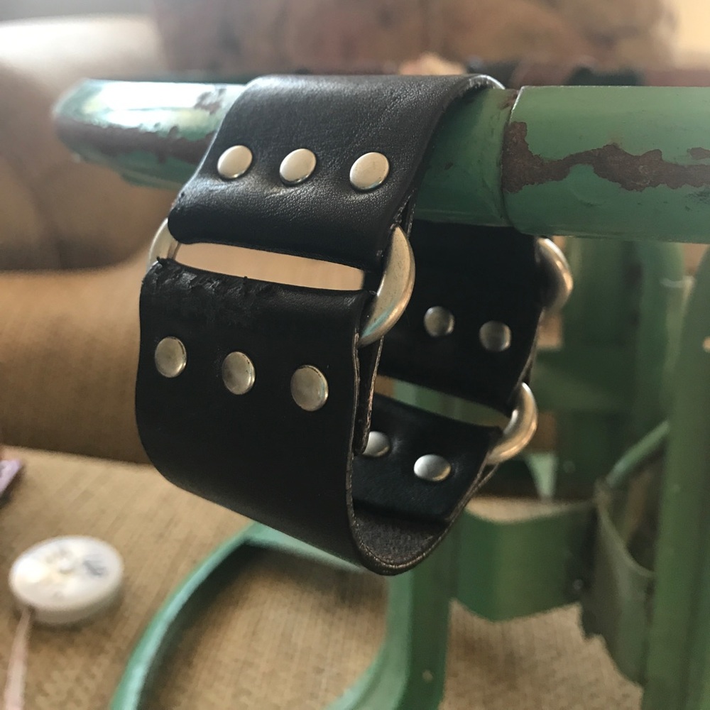 Black up cycled ringed belt into bracelet.
