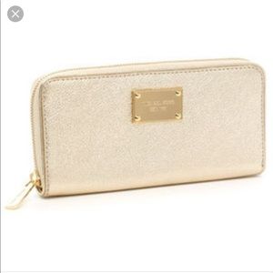 gold michael kors wristlet