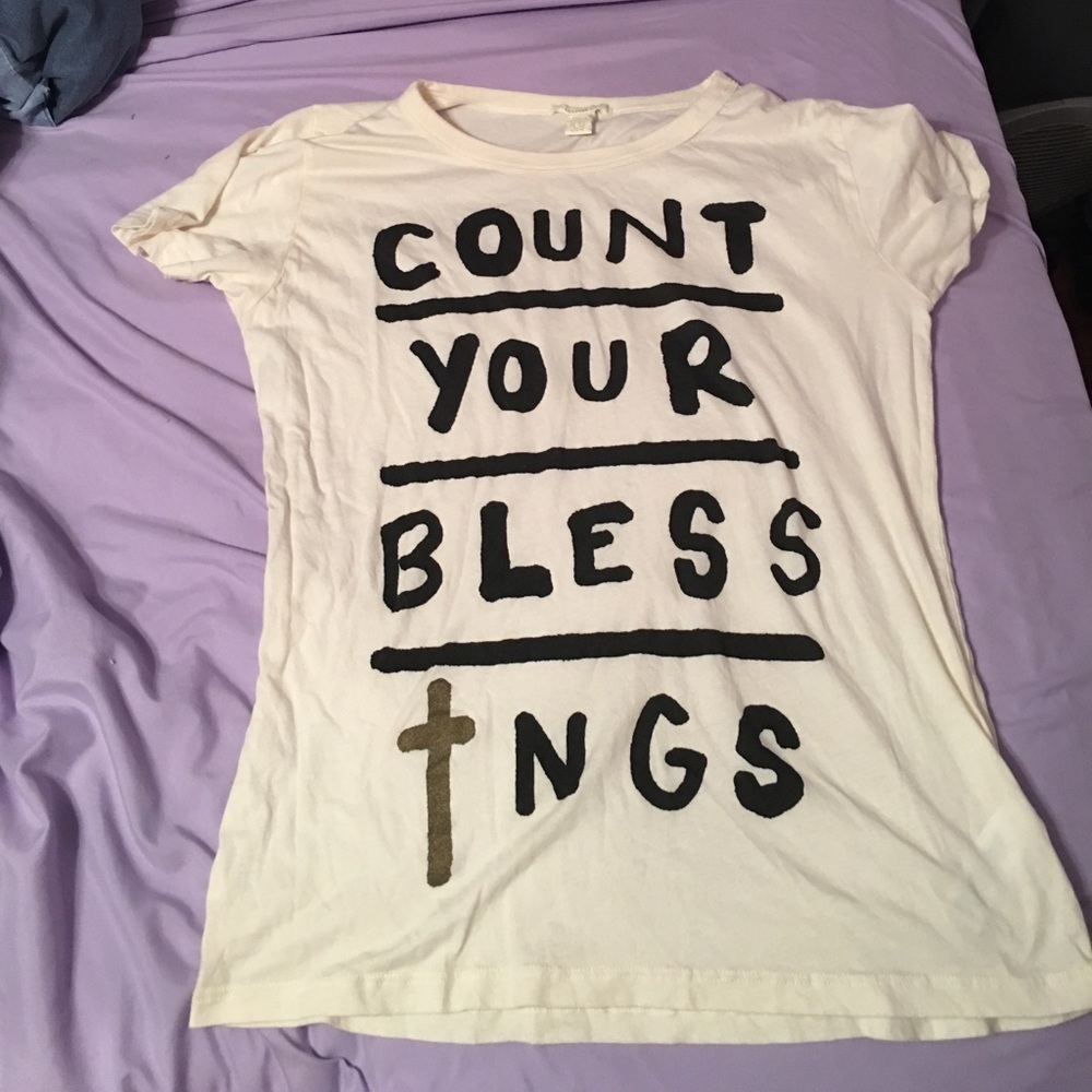 Manila colored tshirt with black writing