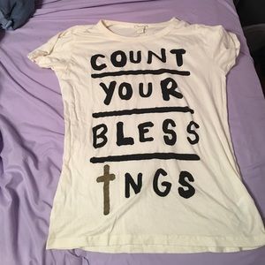 Manila colored tshirt with black writing