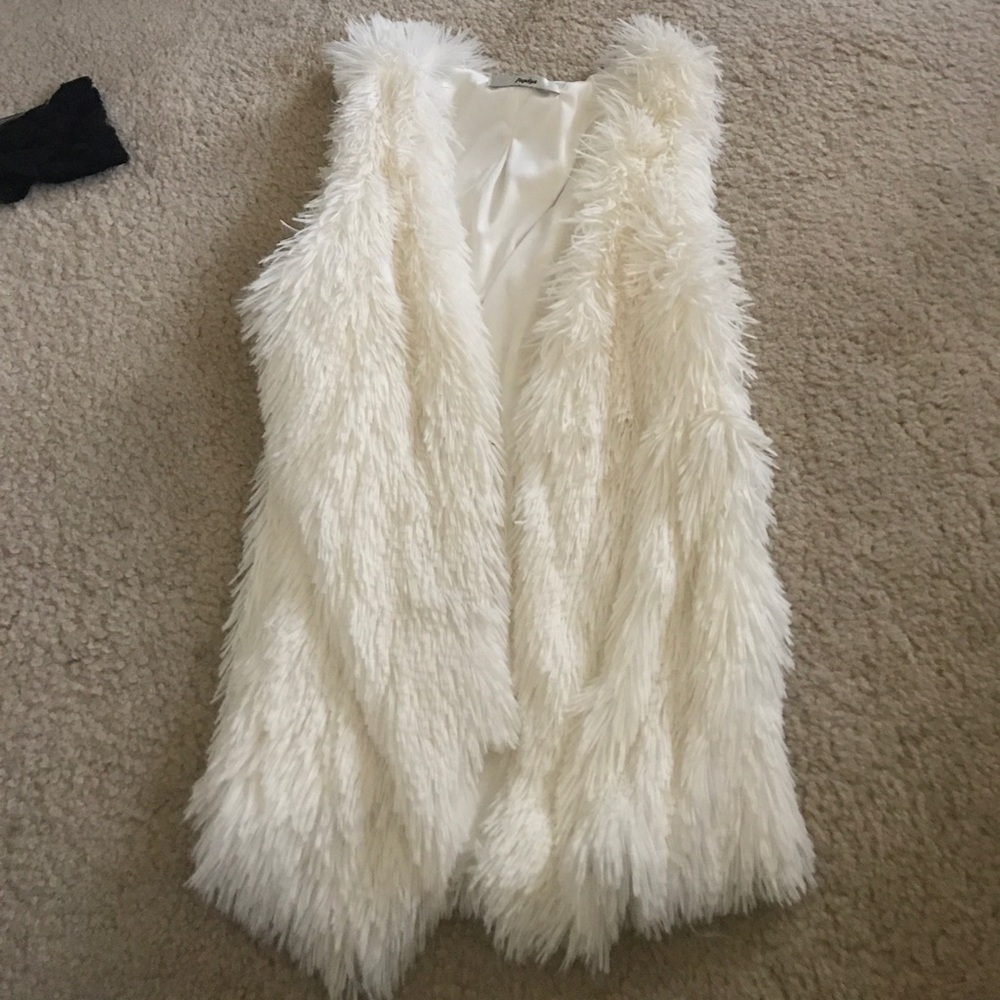 White fur vest