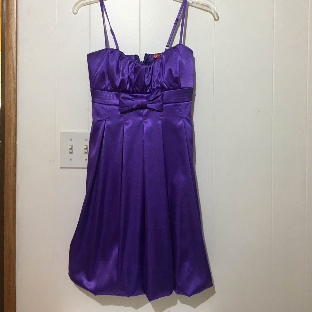 beautiful purple dress with a bow