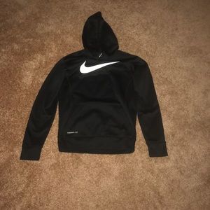 I am selling a black and white Nike sweatshirt.