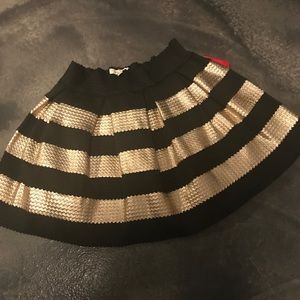 Super cute black and gold skirt.