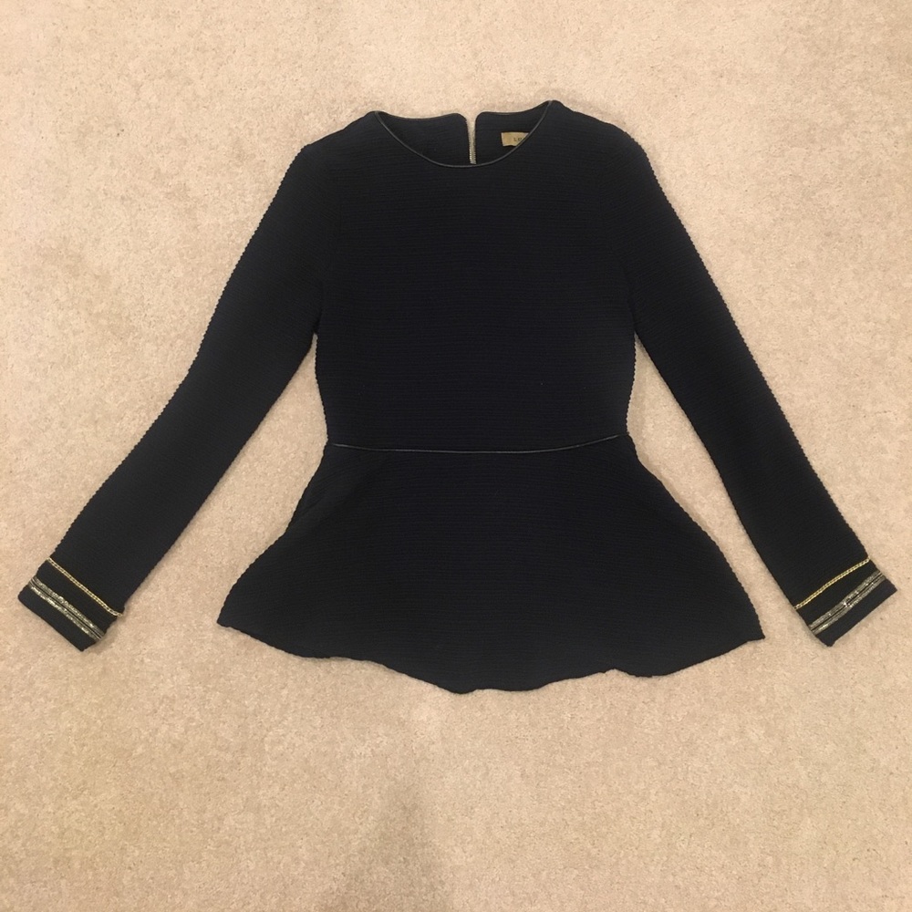 Textured peplum top with cuff detail, zipper back