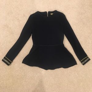 Textured peplum top with cuff detail, zipper back