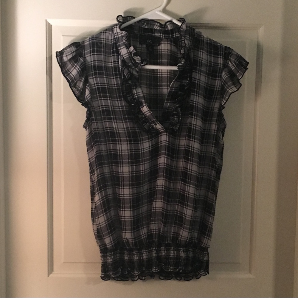 Super cute top.  Dress down or dress it up.