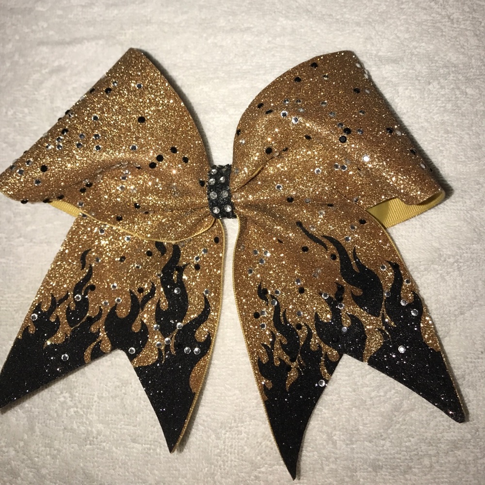 Gold bow with black flames