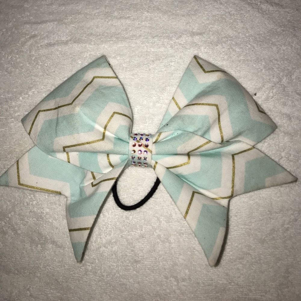 Cloth bow with rhinestones in the center