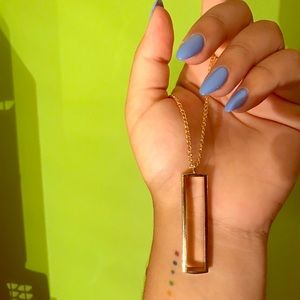 long, simple gold necklace