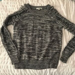 Grey sweater with torn sleeves