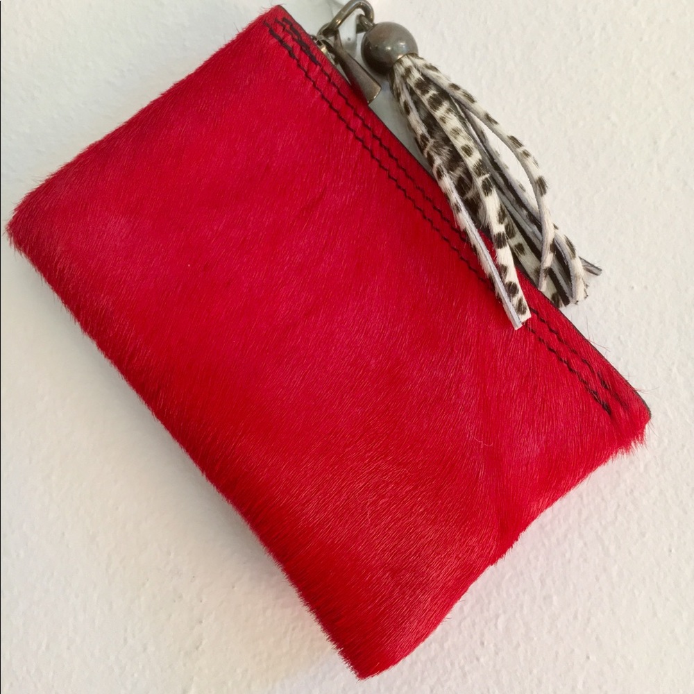 Mini clutch in red leather.