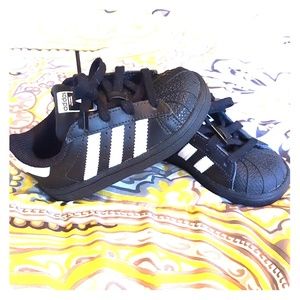 Black and white toddler Adidas Superstars
