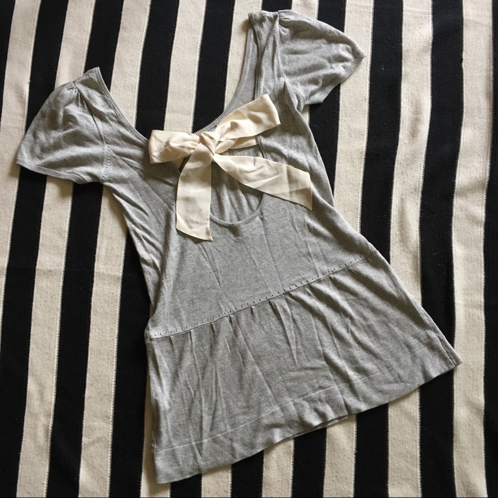 Tunic with open back and bow closure